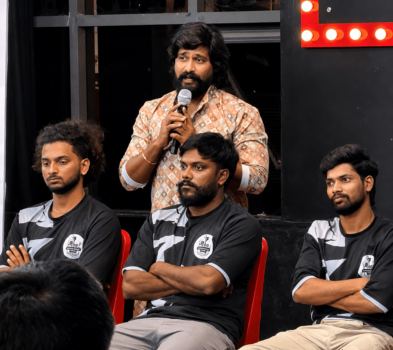 The founder addressing the Style Dance Crew team inside the studio.